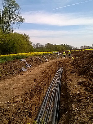 stock-photo-work-in-progress-burying-gas-pipe-in-a-country-area-124224460
